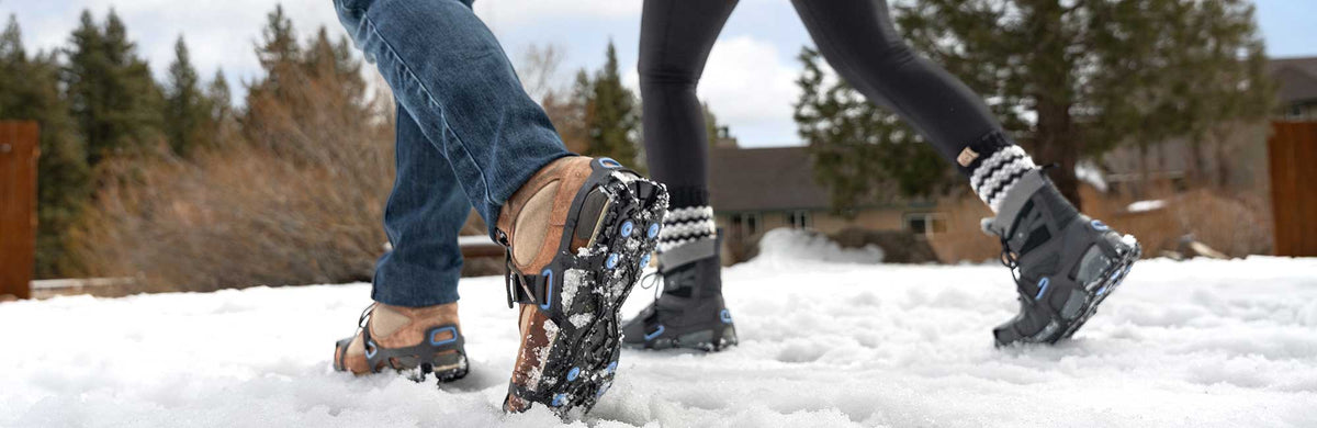 two people walking in the snow